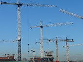 Large construction site with multiple crane use. Anti-collision systems help to prevent accidents